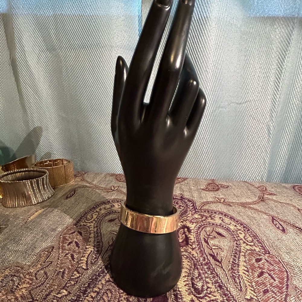 Gold toned hinged bracelet